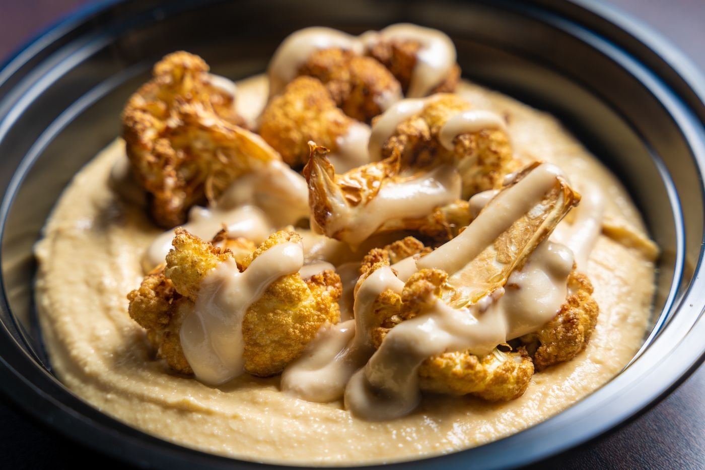 Cauliflower over Tahini Hummus